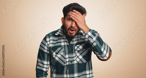 Fotografie Bearded indian man feeling hopelessness loneliness, nervous breakdown, loses becoming surprised by lottery results, bad fortune, loss, unlucky news