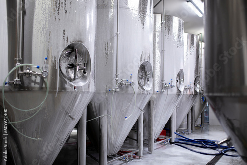 Wallpaper Mural washing large metal tanks in warehouse on the drink production factory Torontodigital.ca