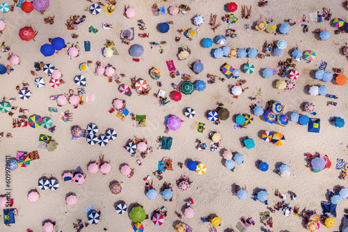 Fun tp down aerial view of people relaxing at the beach in Rio de Janeiro, Brazil. Travel and summer holiday concept.