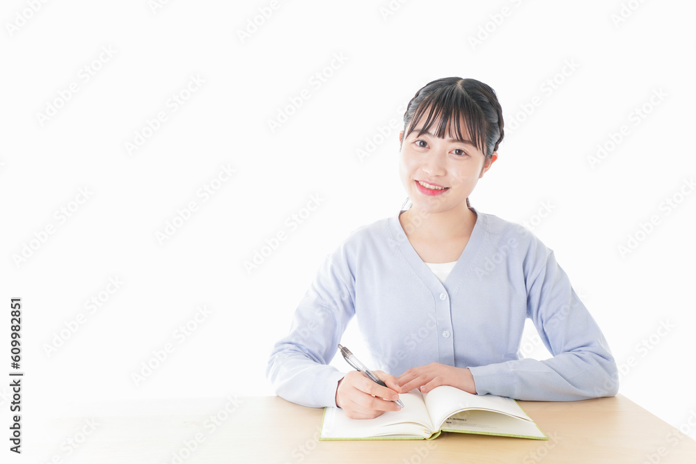 授業を受ける若い女子学生 授業を受ける若い女子学生