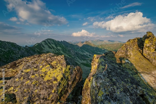 Summer day in the mountains with massive rocks, dramatic skies and majestic mountains. Mountain sunset in Slovakia mountain - Rohace, panorama of the Tatras Western Tatras.