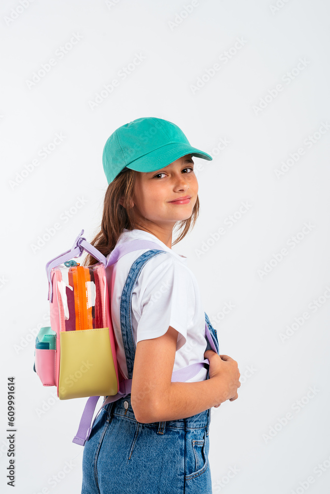 Smiling schoolgirl with backpack and cap Smiling schoolgirl with backpack and cap