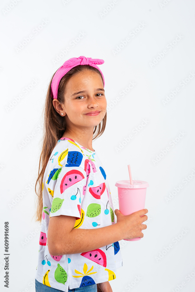 Positive girl with plastic bottle of milkshake Positive girl with plastic bottle of milkshake