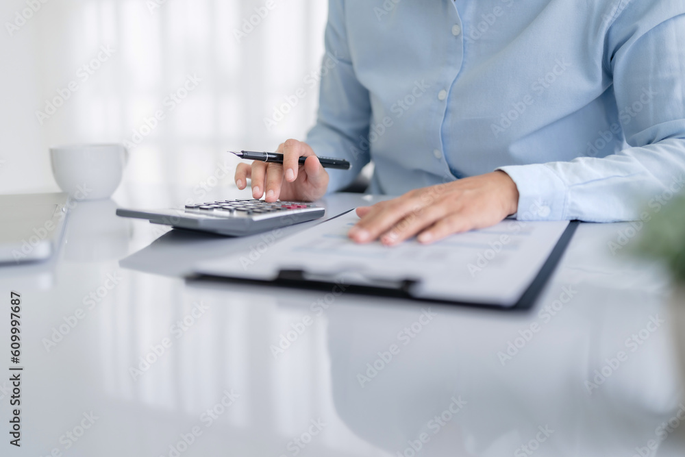 Fototapeta premium Image of woman calculate tax invoice at home, summarizing taxes, money planing..