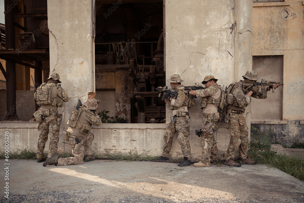 Professional marine soldiers training with weapon on a military range. Professional marine soldiers training with weapon on a military range.