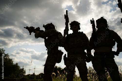 фотографія Soldier holding gun and showing action success or war win, special forces military training concept