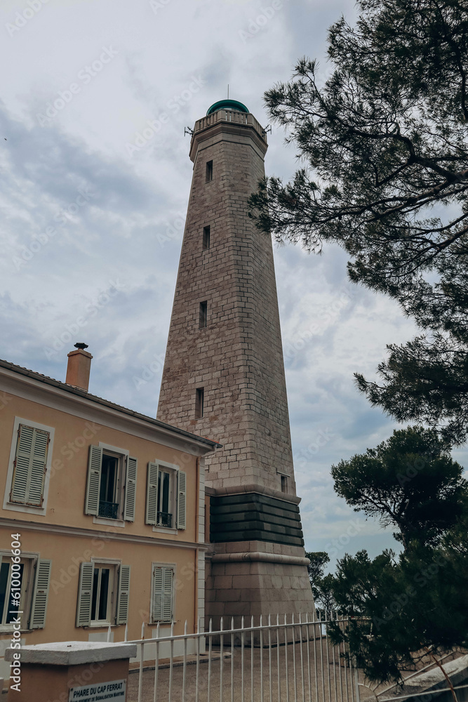 View of the lighthouse on the peninsula of Saint Jean Cap Ferrat in cloudy weather, on the French Riviera