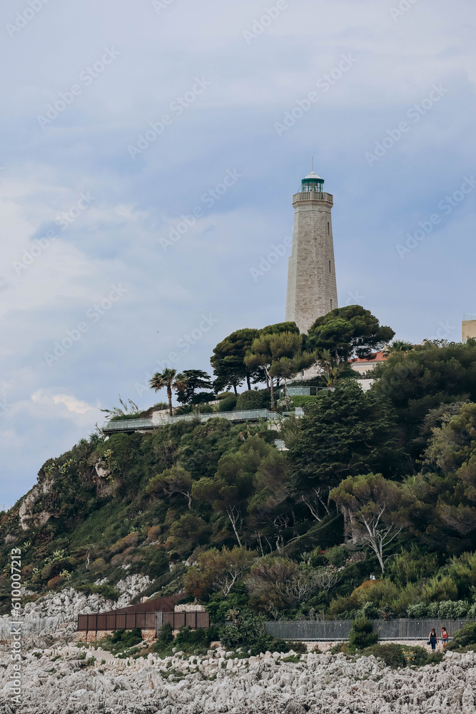 View of the lighthouse on the peninsula of Saint Jean Cap Ferrat in cloudy weather, on the French Riviera