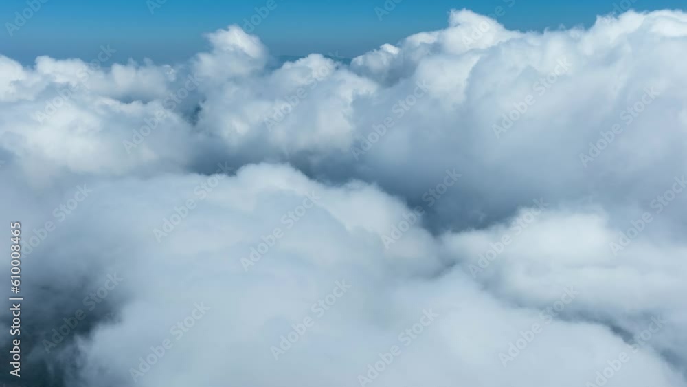 Aerial shot of low clouds moving pass mountains in Taiwan