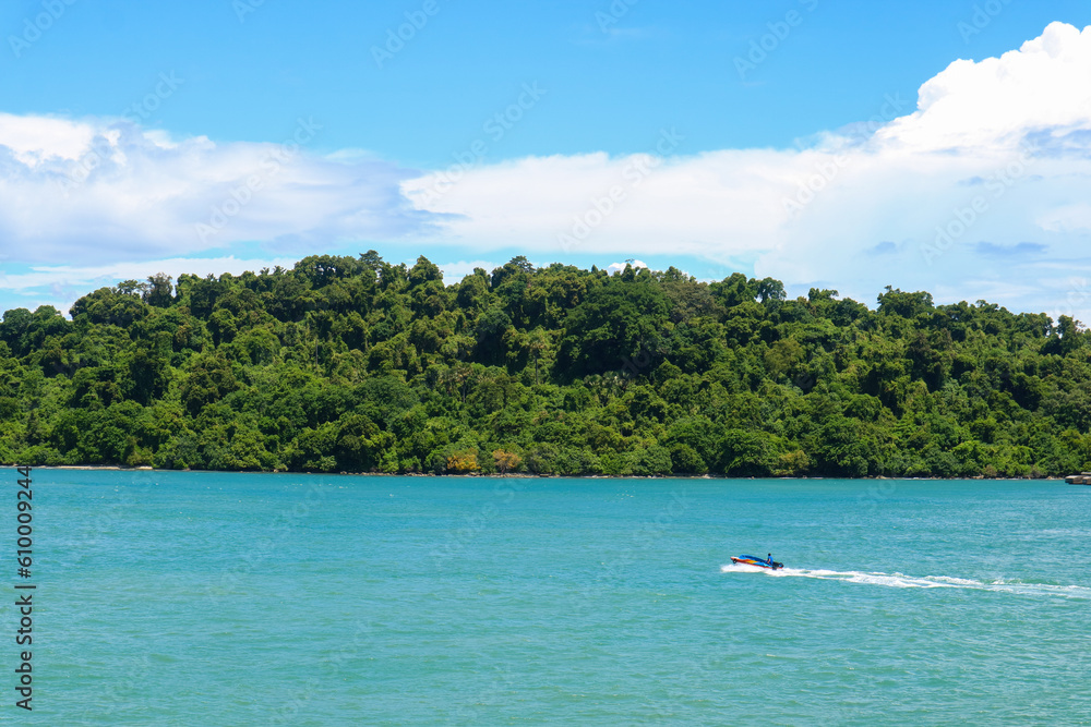 Sea of tropical island with speed boat and sky natural beauty in sunda strait, Indonesia.