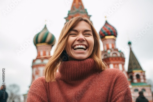 Portrait of a smiling girl on the background of the Moscow Kremlin