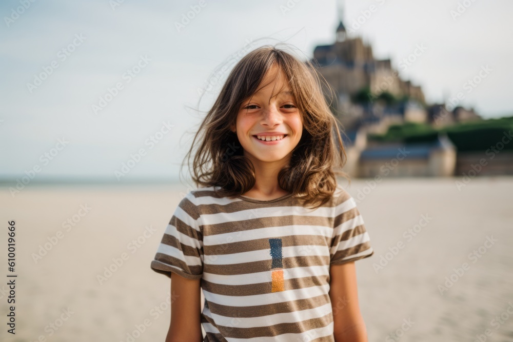 Portrait of a cute little girl on the beach in France. Portrait of a cute little girl on the beach in France.
