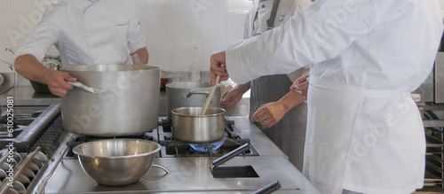 Cooking school chef team helping each other to finish the good food