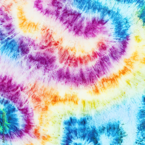 Pink, yellow and blue spiral tie dye seamless pattern abstract background. Swirl color neon tie dye pattern abstract texture .