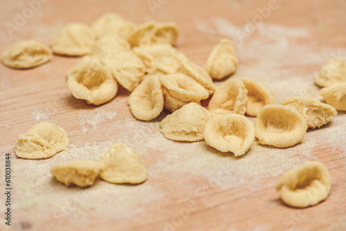Fresh orecchiette or orecchietta, handmade pasta made with durum wheat and water, typical of Puglia or Apulia, a region of Southern Italy, close up