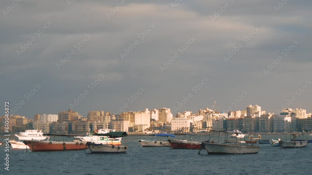 Group of Moored Boats on the Water on the Background of the City Buildings Group of Moored Boats on the Water on the Background of the City Buildings