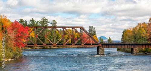 Foto Autumn colors on the river at Moosehead Lake, Maine - train trestle
