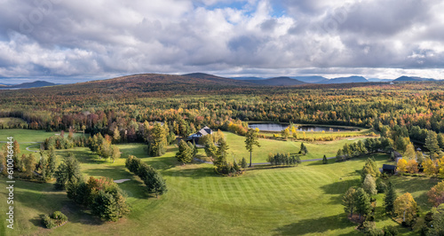 Morning light showing brilliant autumn colors on the Greenville Country Club - Moosehead Lake - Maine