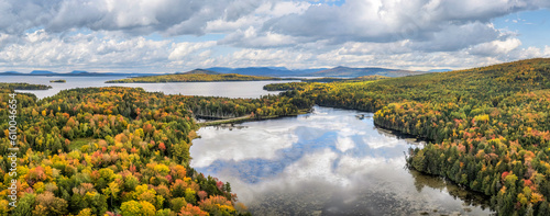 Fototapeta Naklejka Na Ścianę i Meble -  Autumn panorama at Moosehead Lake - Maine - Train tracks along the lakeshore