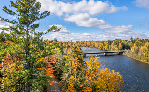 Autumn colors on the river at Moosehead Lake, Maine - scenic drive