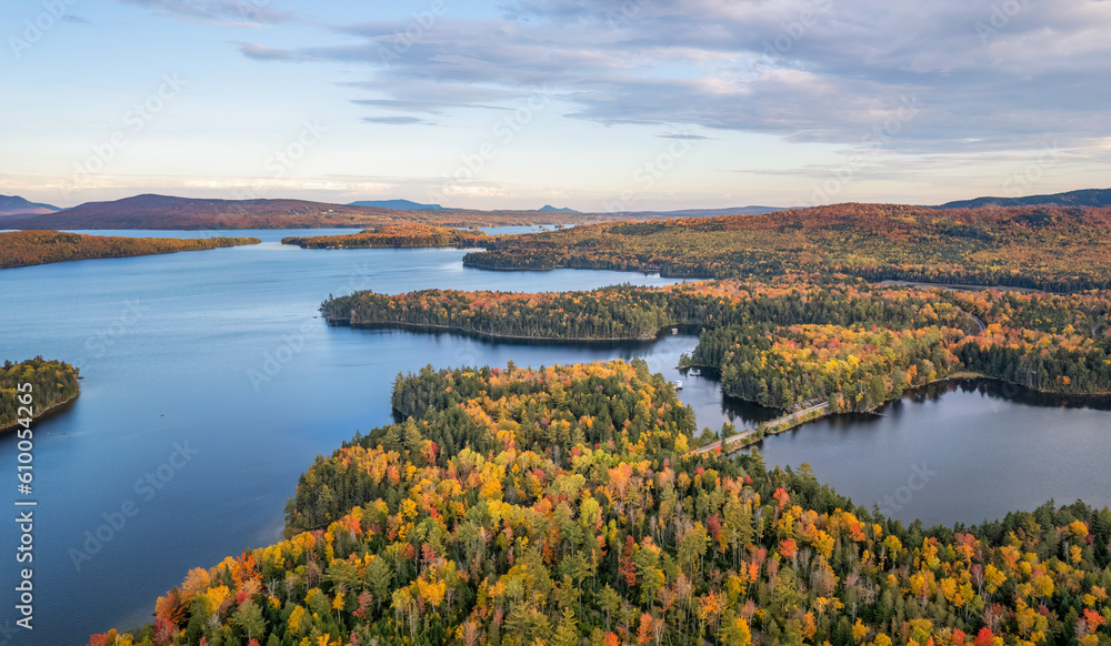 Fototapeta premium Autumn colors at Moosehead Lake - Maine - train tracks along the shoreline