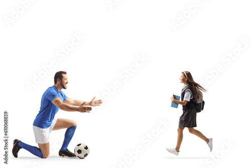 Schoolgirl running to hug a football player