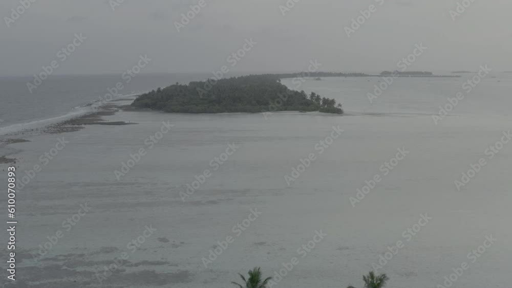 A beautiful bird's eye view of tropical islands in the Maldives. Aerial photography of exotic tropical islands. Footage without color correction. A beautiful bird's eye view of tropical islands in the Maldives. Aerial photography of exotic tropical islands. Footage without color correction.