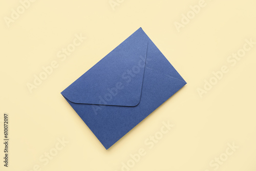 Blue envelope on yellow background. Message concept