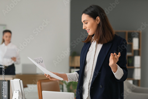 Female accountant with docu...