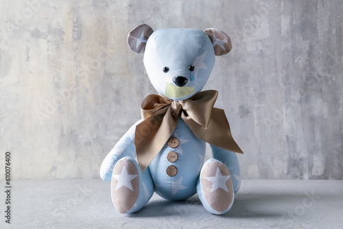 Toy bear with taped mouth a...