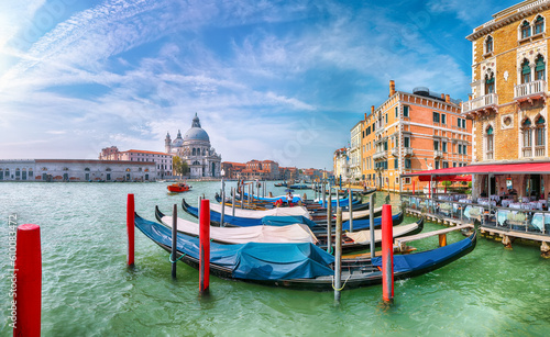 Breathtaking morning cityscape of Venice with famous Canal Grande and Basilica di Santa Maria della Salute church.