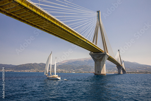 The sailboat passes under the Rio-Antirrio Bridge or Charilaos Trikoupis Bridge, photo taken from the boat.