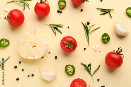 Composition with ripe cherry tomatoes  jalapeno and spices on beige background