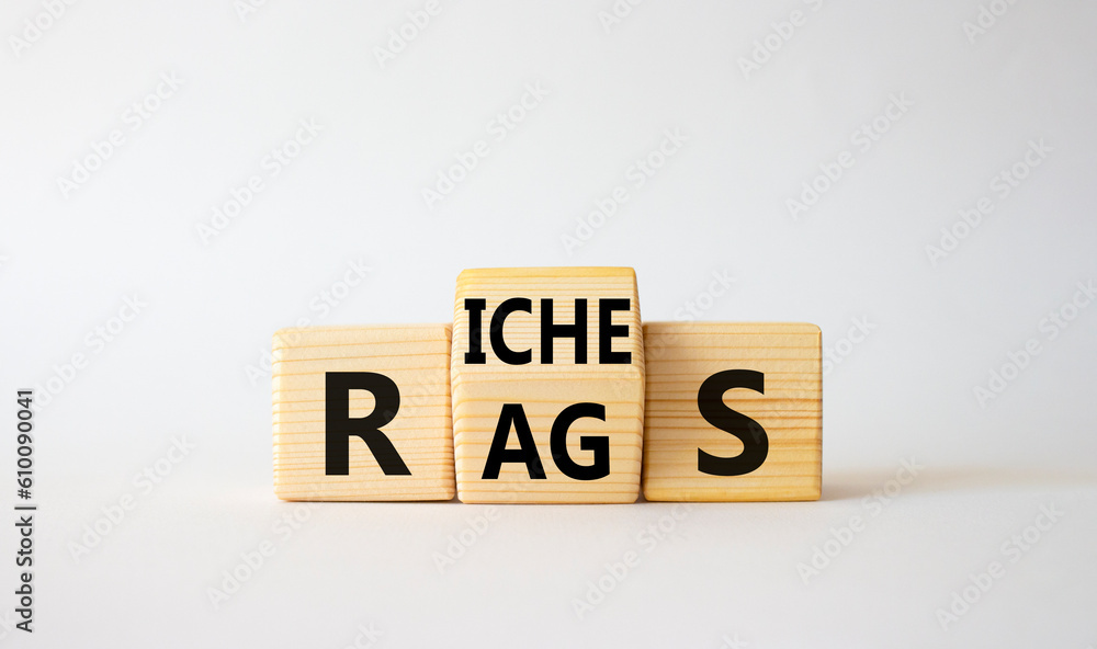 Rags vs Riches symbol. Wooden cubes with words Rags and Riches. Beautiful white background. Rags vs Riches and business concept. Copy space Rags vs Riches symbol. Wooden cubes with words Rags and Riches. Beautiful white background. Rags vs Riches and business concept. Copy space