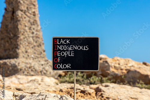 BIPOC black indigenous people of color symbol. Concept words BIPOC black indigenous people of color on blackboard. Beautiful stone background. Business BIPOC black indigenous people of color concept. © Dzmitry