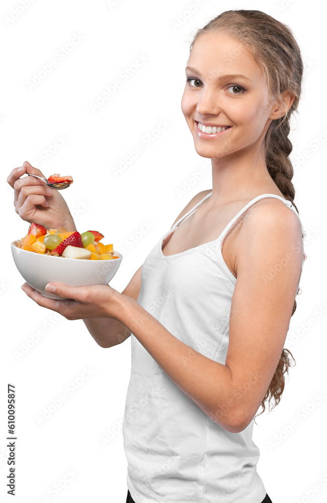 Portrait of a Young Woman Eating a Fruit Salad Portrait of a Young Woman Eating a Fruit Salad
