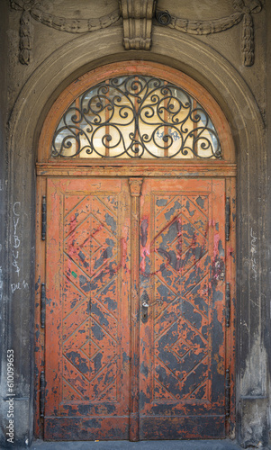 Old door in an old church. Festoon fretwork stone decoration. Architecture elements.