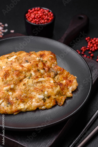 Delicious fried chicken breast in batter with mustard, salt, spices and cheese © chernikovatv