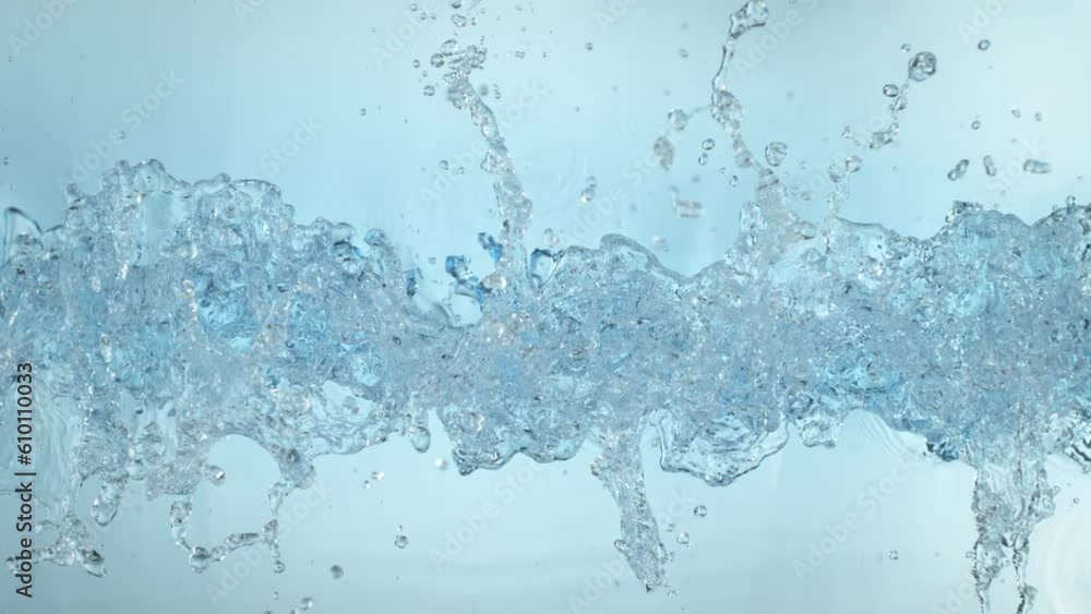 Super Slow Motion Shot of Clear Water Wave Splash on Light Blue Background at 1000fps. Super Slow Motion Shot of Clear Water Wave Splash on Light Blue Background at 1000fps.