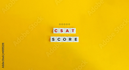 CSAT (Customer Satisfaction) Score. Letter Tiles on Yellow Background. Minimal Aesthetics.