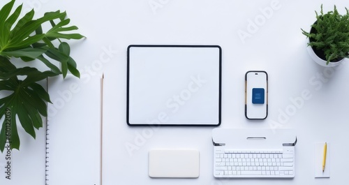 White office desk laptop with a tablet flat lay