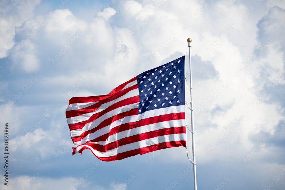 American Flag flying on cloudy day American Flag flying on cloudy day