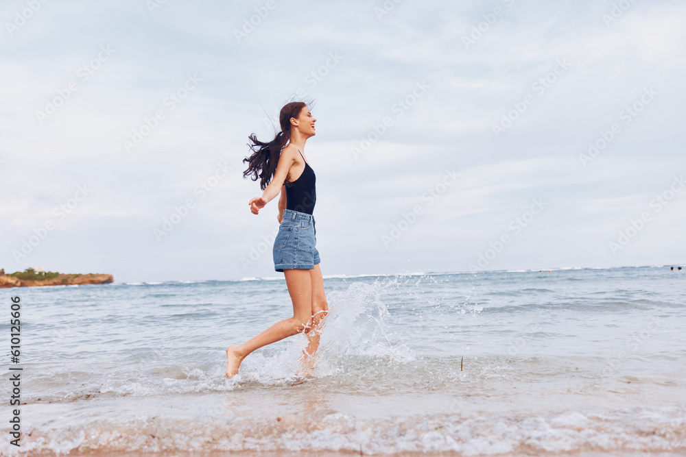 woman beach young summer positive running travel sea smile sunset lifestyle