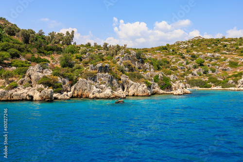 View of the rocky shore from the sea. Mediterranean Sea in Turkey. Popular tourist places. Background © Iurii Gagarin