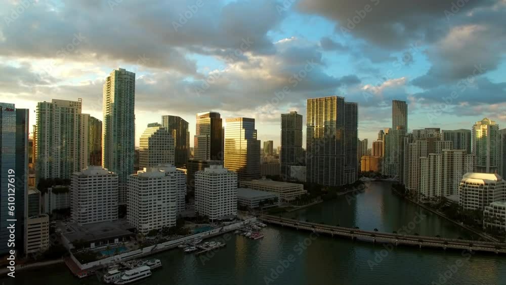 Aerial Shot Of Bridge Near Boats And Modern Buildings In City, Drone Flying Forward Over Sea Against Cloudy Sky At Sunset - Miami, Florida Aerial Shot Of Bridge Near Boats And Modern Buildings In City, Drone Flying Forward Over Sea Against Cloudy Sky At Sunset - Miami, Florida
