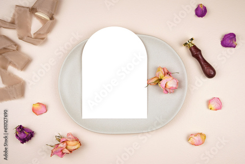 5x7 arch card wedding stationery suite mockup. Styled with silk ribbon, vintage wax seal and dried roses on a beige background. Menu card.