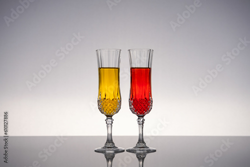 Champagne glass on shiny gray surface