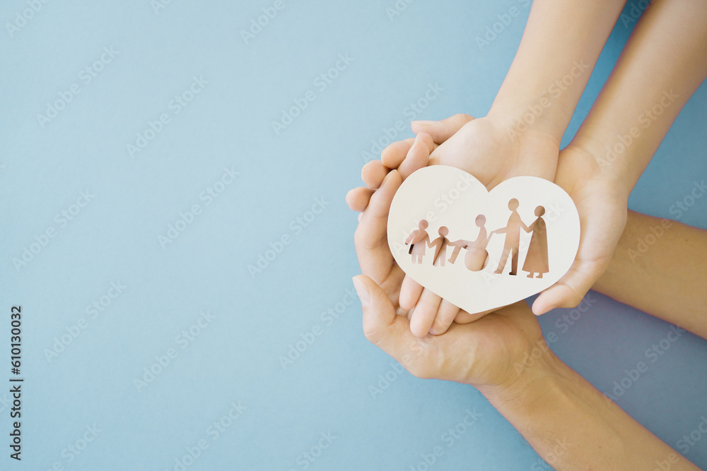 Hands holding diversity family in heart shape, happy carer and volunteer, disable nursing home, rehabilitation and health insurance concept - obrazy, fototapety, plakaty 