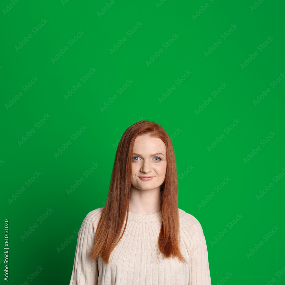 Chroma key compositing. Pretty young woman with red hair against green screen Chroma key compositing. Pretty young woman with red hair against green screen