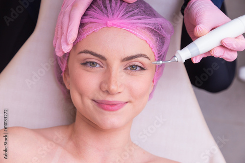 closeup photo of woman's face, photo of aesthetics, anti aging procedures. Plasma jet application. Aesthetics, spa. beautician. photo